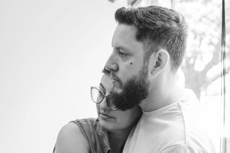 A couple supports each other while preparing to discuss abortion and other pregnancy options.